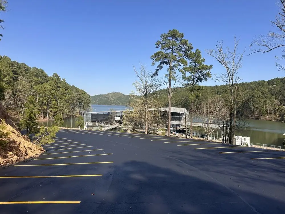 A finished lot beside the water at Hot Springs, sealed black with fresh yellow lines