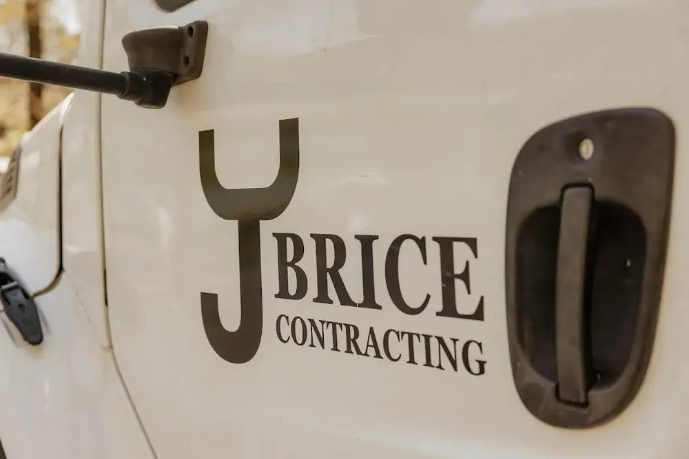 The Brice Contracting logo on the door of a crew truck
